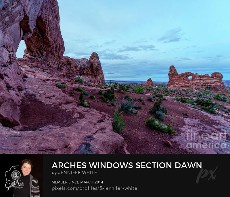 An early blue hour morning before sunrise standing by the South Window Arch Formation which you can see on the left, and on the right you can see Turret Arch. This is at the Windows Section in Arches National Park in Moab, Utah, United States. It was a peaceful and quiet early spring season morning in May.