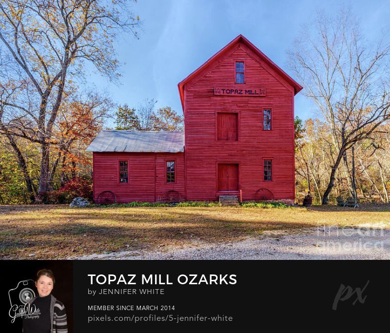 A straight-on photograph of the historic Topaz Mill in Cabool, Missouri, showcases one of the most beautiful and well-preserved grist mills in the Ozarks region. Built in 1895, the iconic red mill replaced an earlier 1840 structure, though its history remains a mystery. Surrounded by the scenic beauty of the Mark Twain National Forest, Topaz Mill is a favorite destination for photographers, history lovers, and travelers exploring Missouri’s Ozarks. Captured during the vibrant fall season, this image highlights the charm and heritage of one of Missouri’s hidden gems.
This photo was taken by Jennifer White with Timeless Moments Photography. All images are copyrighted © Timeless Moments Photography/Jennifer White. All rights reserved.