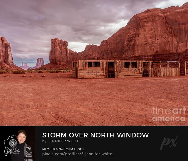 In this photograph I captured this storm rolling in over the famous North Window viewpoint in Monument Valley in Navajo Tribal Park in Arizona, USA. There's a wooden log building where local Navajo Indians set up to sell arts and crafts,. To the right behind the building is Cly Butte. To the far left you can see part of Elephant Butte and between in the distance is the iconic backside of East Mitten and the furthest is Stagecoach Butte.