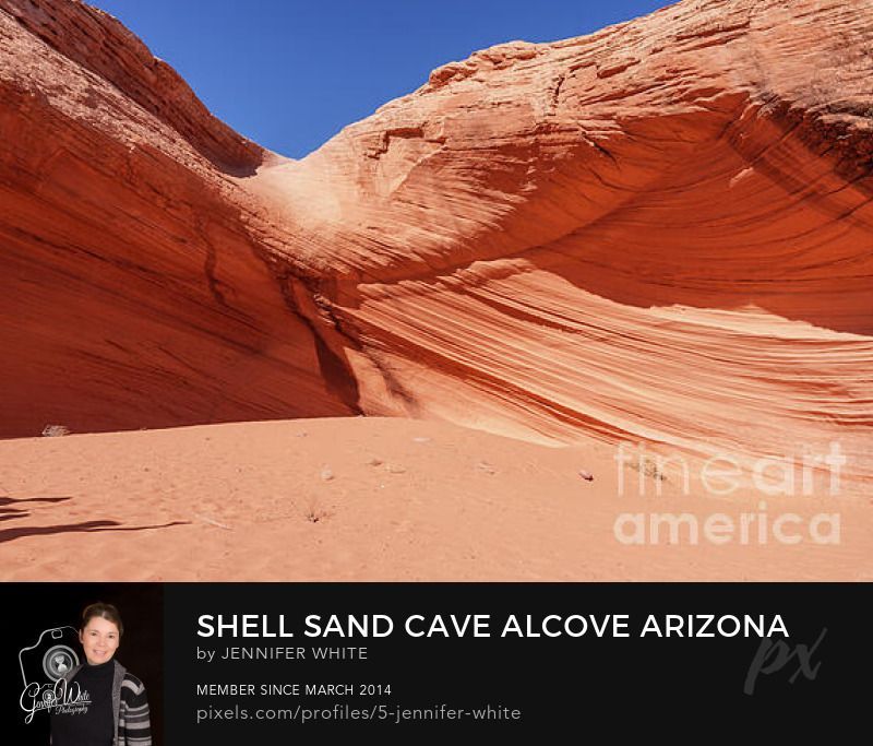 This vibrant orange sandstone formation, commonly known as Shell Sand Cave, is tucked behind a Shell gas station near Page, Arizona, the origin of its well-known nickname.
