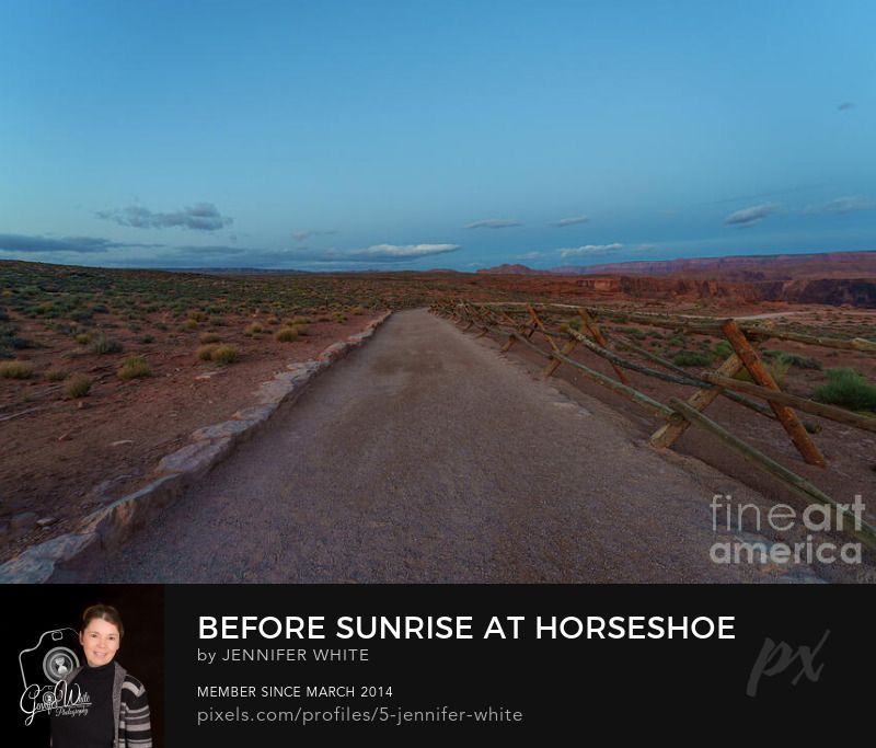 A peaceful pre-dawn scene along the trail leading to Horseshoe Bend within Glen Canyon National Recreation Area in Page, Arizona, USA. Before the sun rises, the sky is painted with soft and bold shades of blue, with delicate clouds drifting overhead.
The winding path gently curves through the quiet desert landscape, guiding the way toward one of the Southwests most iconic views. A wooden fence lines portions of the trail, adding a rustic element while leading the eye deeper into the scene.
Set within the lands of the Navajo Nation, this tranquil moment captures the stillness of early morning, an inspiring and peaceful start to the day in the American Southwest.
This photo was taken by Jennifer White with Timeless Moments Photography. All images are copyrighted Timeless Moments Photography/Jennifer White. All rights reserved.