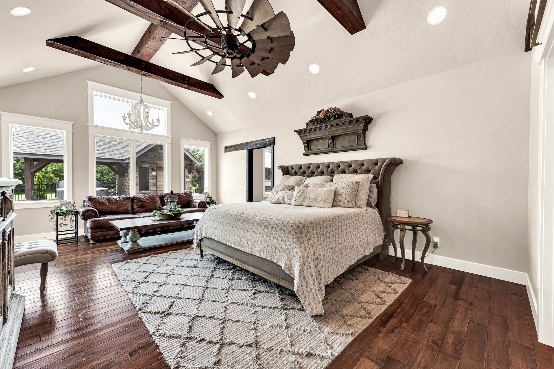 A interior professional photo of an owner's bedroom suite from a luxury home in Rogersville, Missouri. Professional photo by Jennifer White Timeless Moments Photography. Home built by Old World Cottages near Springfield Missouri.