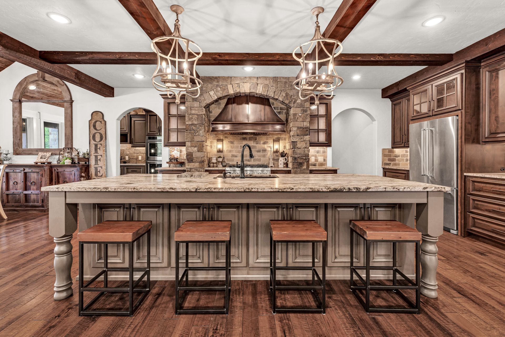 A interior straight on photo of a luxury kitchen in Rogersville, Missouri. Professional photo by Jennifer White Timeless Moments Photography. Home built by Old World Cottages near Springfield Missouri.