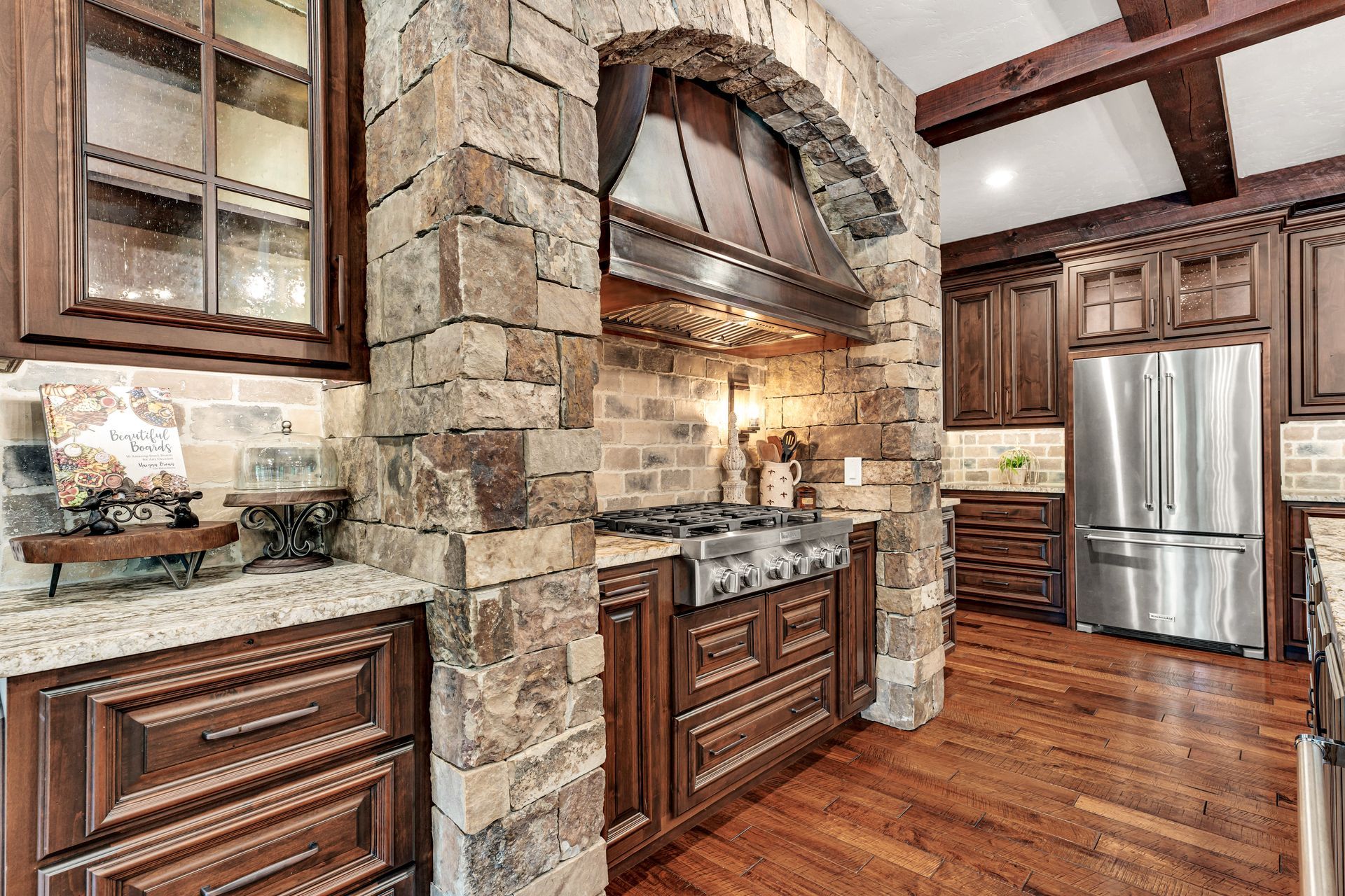 A interior photo of a luxury kitchen oven area in Rogersville, Missouri. Professional photo by Jennifer White Timeless Moments Photography. Home built by Old World Cottages near Springfield Missouri.