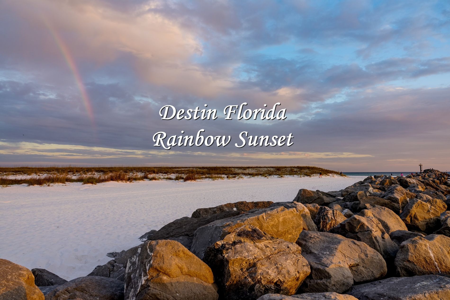 A rainbow appeared while I was taking fine art photos of a Destin Florida sunset.