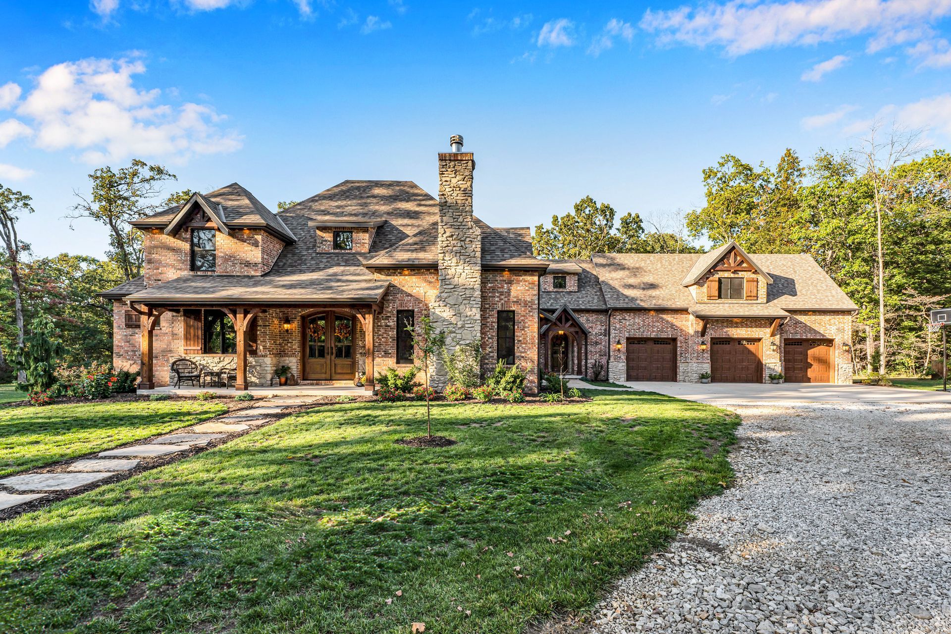 An exterior home professional real estate photo by Jennifer White Timeless Moments Photography of a home built by Old World Cottages near Springfield Missouri.