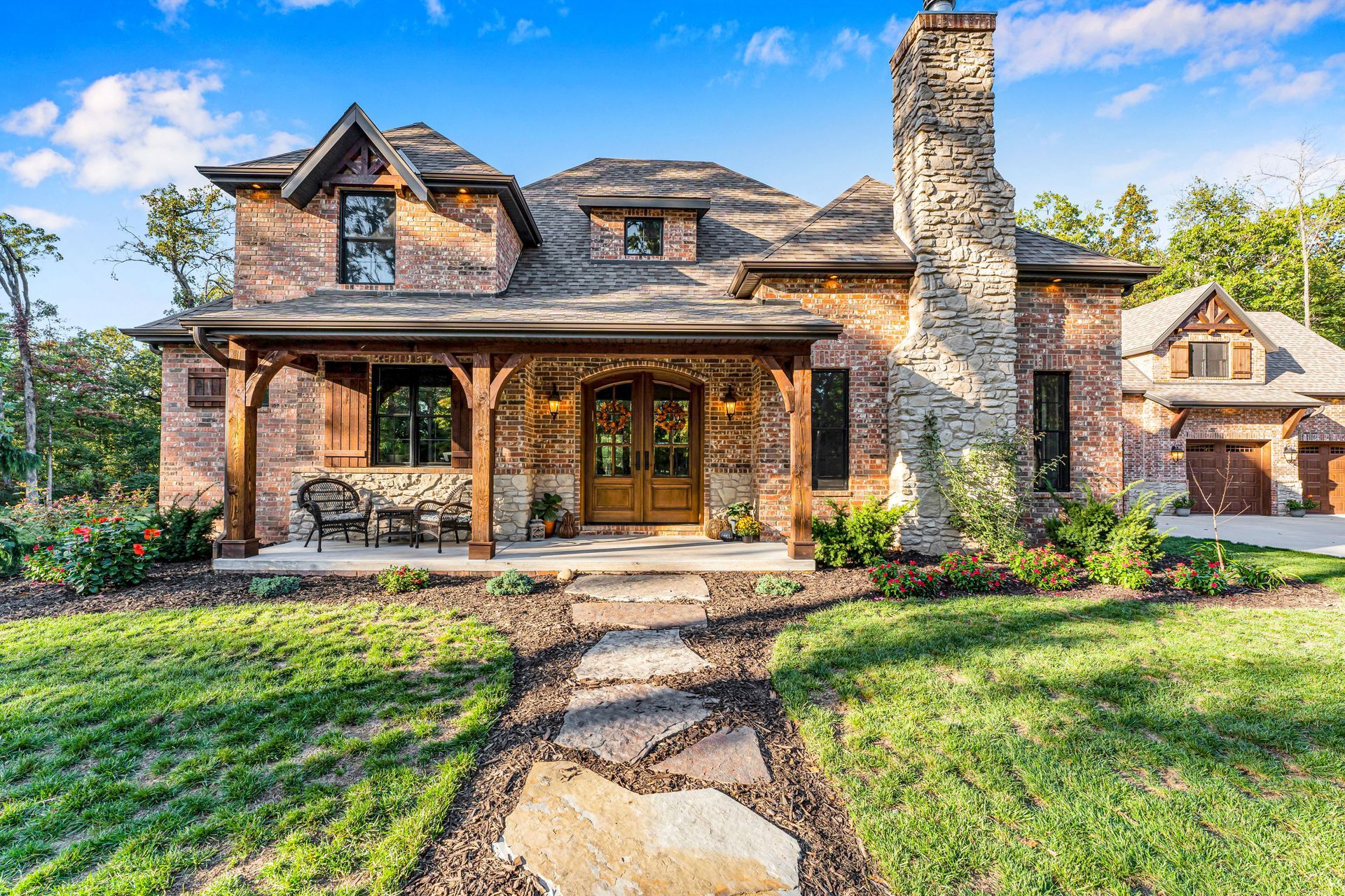 An exterior home professional real estate photo by Jennifer White Timeless Moments Photography of a home built by Old World Cottages near Springfield Missouri.