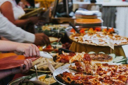 Wood fired pizza catered wedding buffet. Photo courtesy  ©Cat Dossett I Take Photos Wood fired pizza catered wedding buffet. Photo courtesy ©Cat Dossett I Take Photos