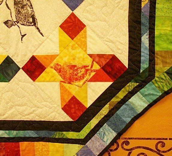 Art exhibit of locally made quilts ©Flying Squirrel Bakery Cafe, LLC