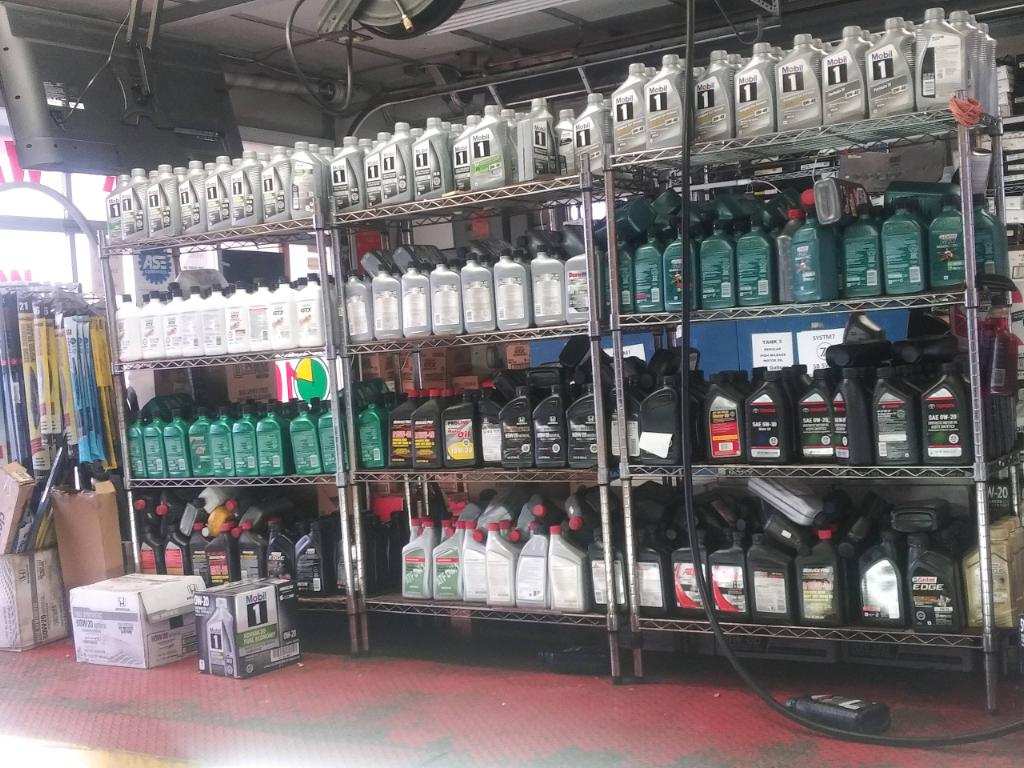 an employee doing an oil change