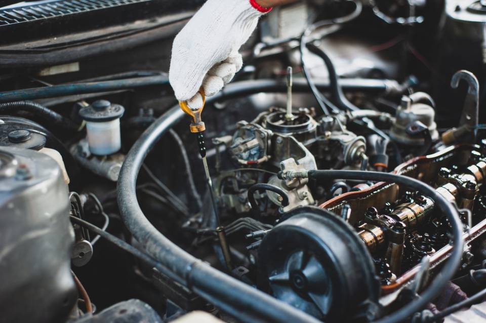 a person checking oi levels in a acr