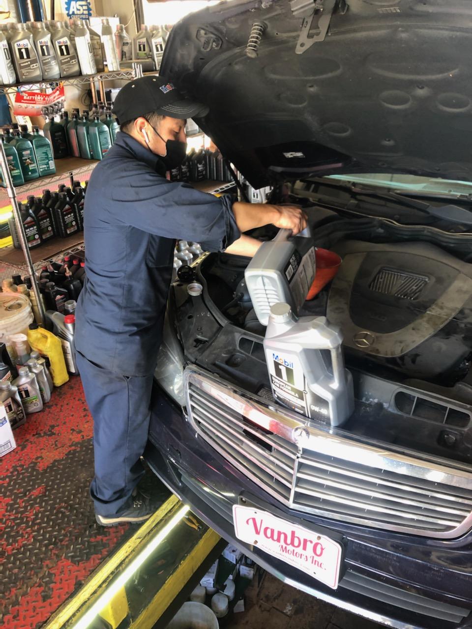 new oil being poured into a car