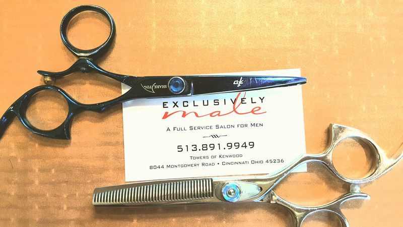 Exclusively Male Salon business card with scissors and comb