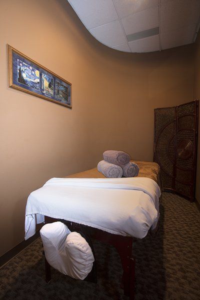 Towels stacked on top of massage table