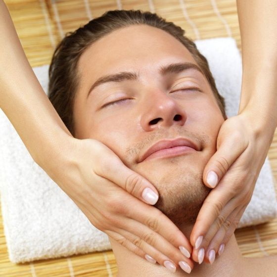 man getting a facial skin care treatment