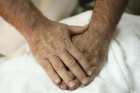 man giving Reiki healing treatment