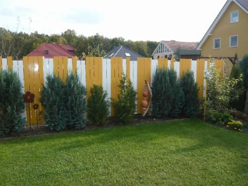 Gartenzaun bunt beschichtet gelb und weiß
