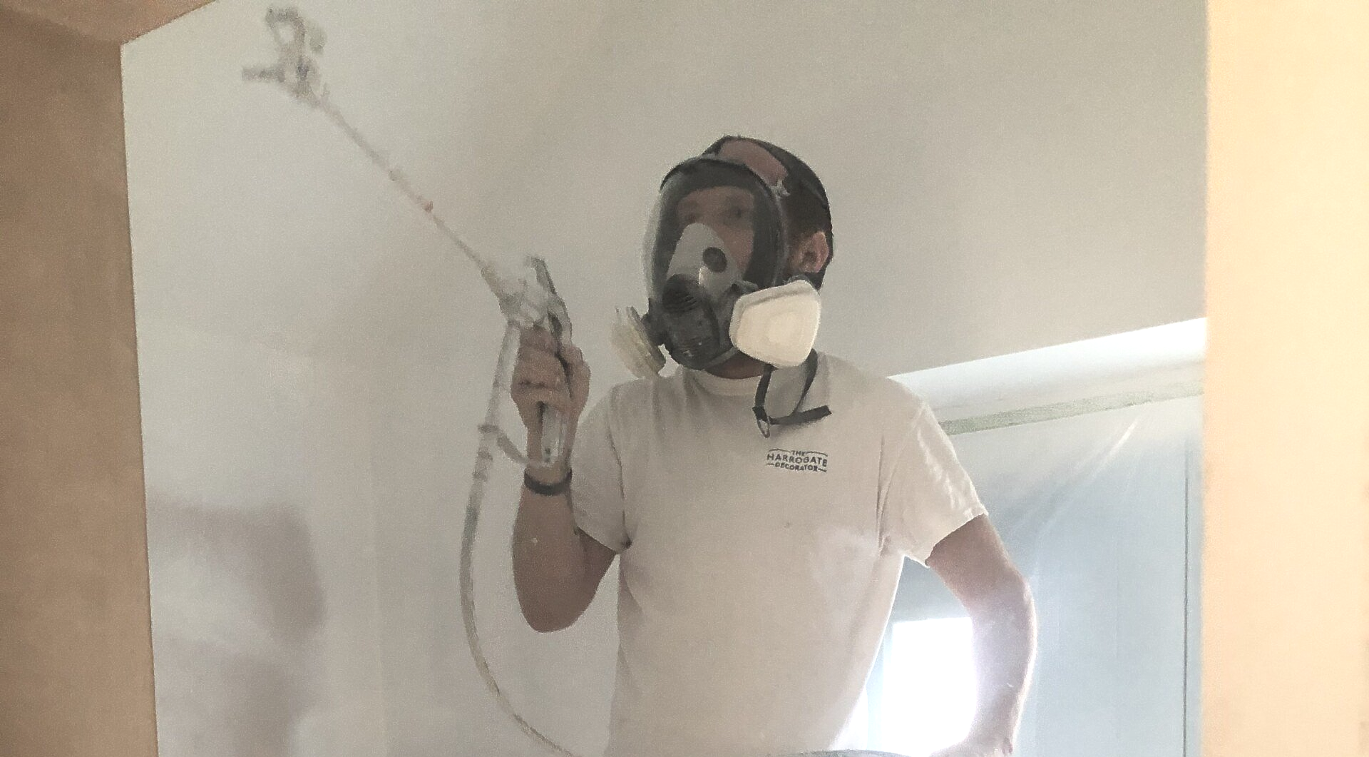 man spray painting