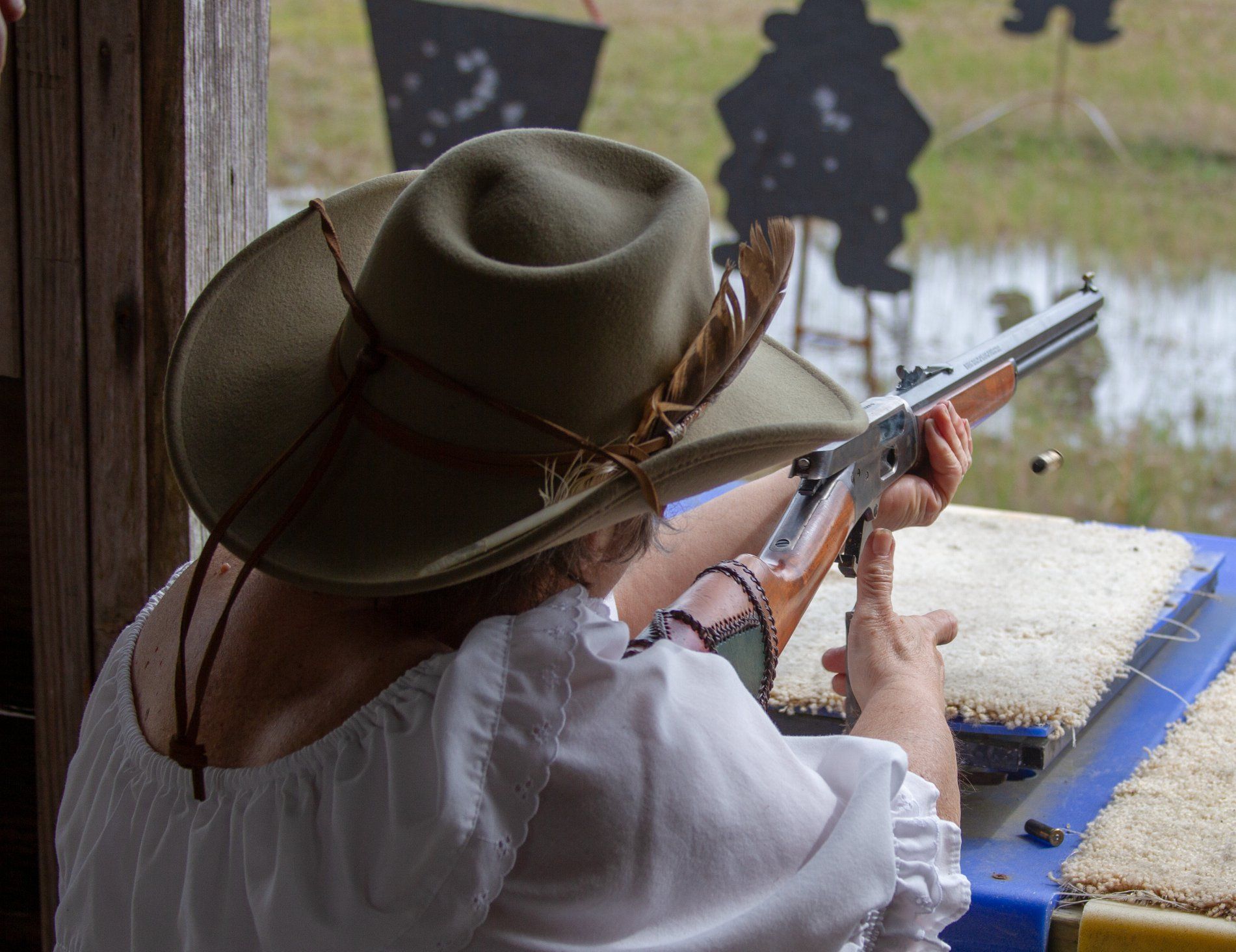 Lady shooting rifle