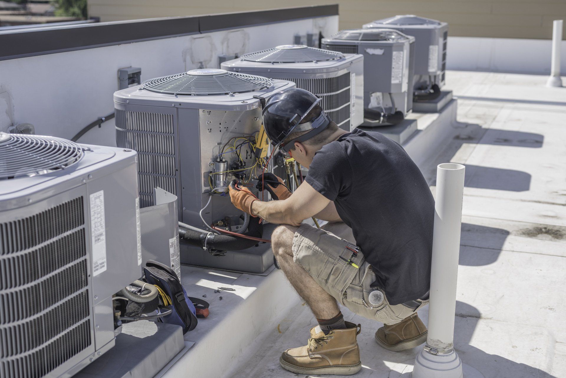 HVAC technician repairing a furnace in a home in Ann Arbor