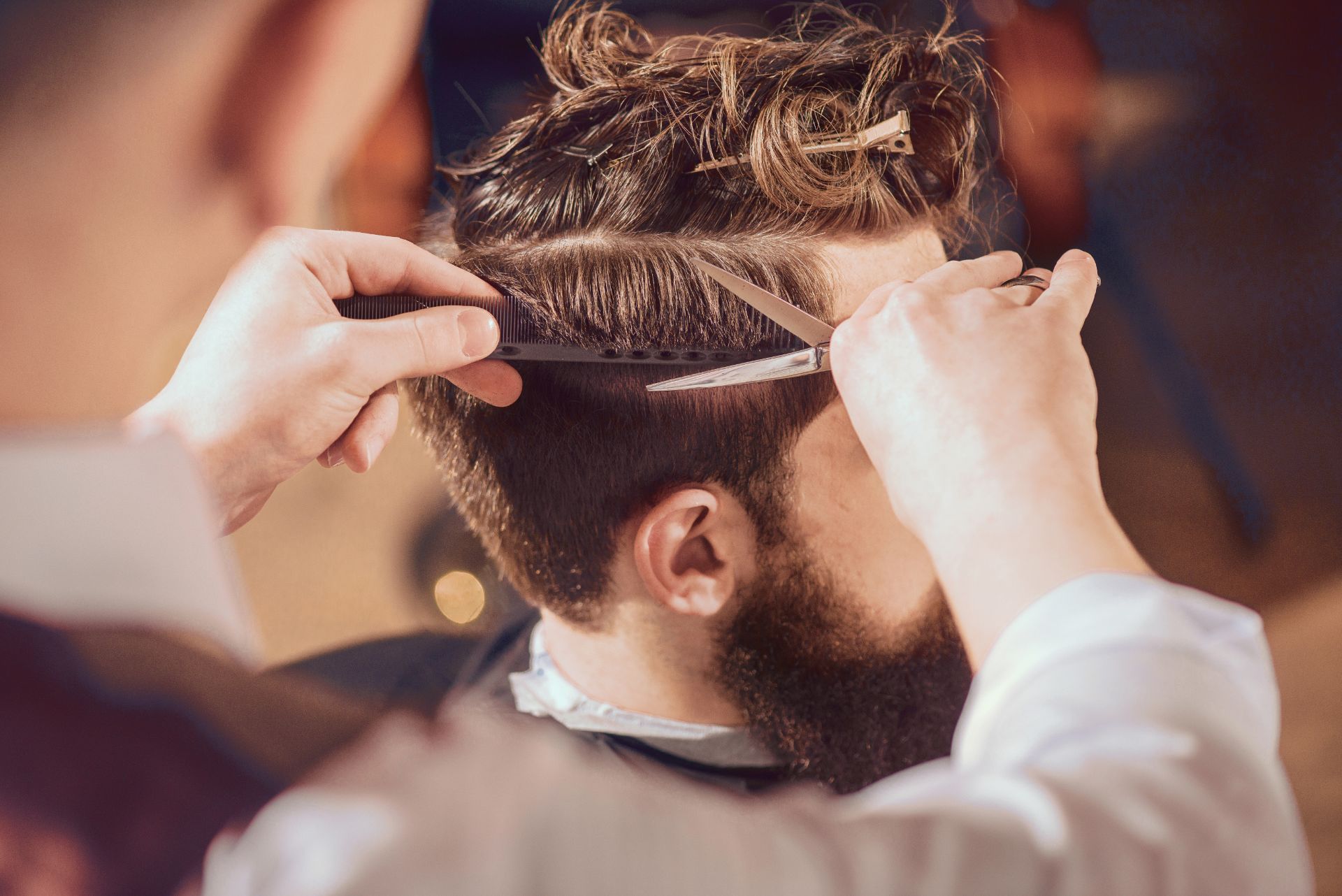 a man receiving a hair cut
