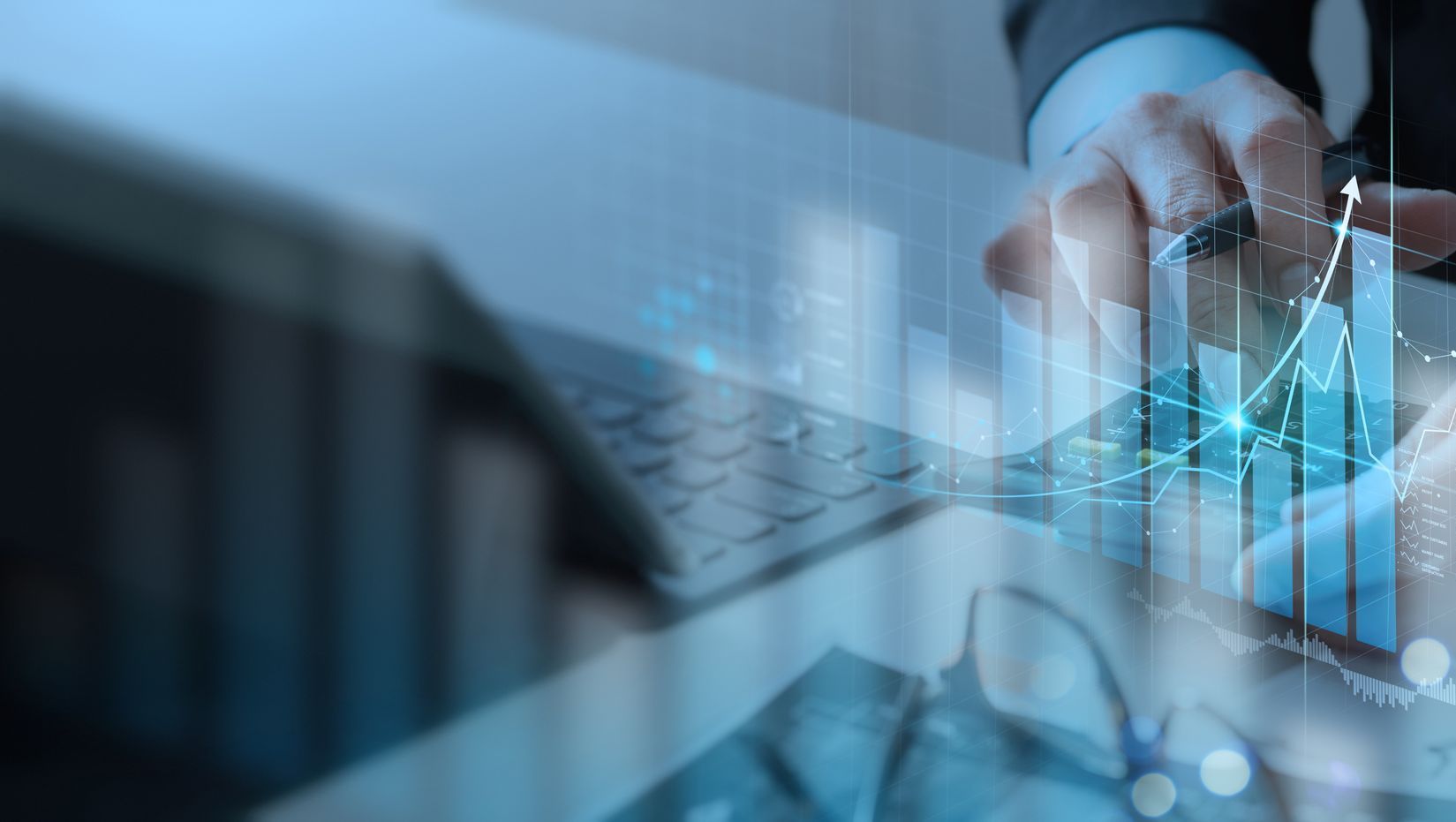 image slider: (Picture 1) the shoulder and arm of a man in a blue pin striped suit holding a pencil with a glowing light at the tip writing what looks like schematics to business success, graphs showing growth, and a chart showing dollar signs and the words success, web, income, business, idea, up, and teamwork (Picture 2) Image of a handshake of two individuals in gray blue suits with faded background (Picture 3) Image of a man in a suit with his hand out with palm facing upwards, inside palm a gray arrow zig zags up and then down and a red arrow zig zags under the gray arrow and up crashing through the gray arrow, pieces of the gray arrow break off meaning to show impressive growth smashing through failure, background of image has glowing blue light behind the man fading into dark navy blue then to black