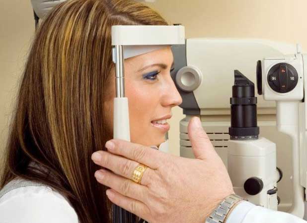 Optometrist performing eyetest