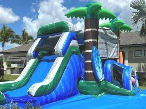 Inflatable bounce house and slide