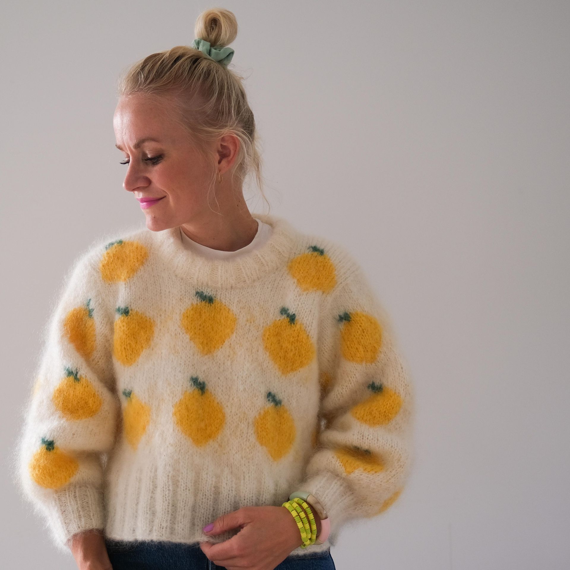 a photo of Catharina Ilstad from HipKnitShop with a hand knitted design sweater