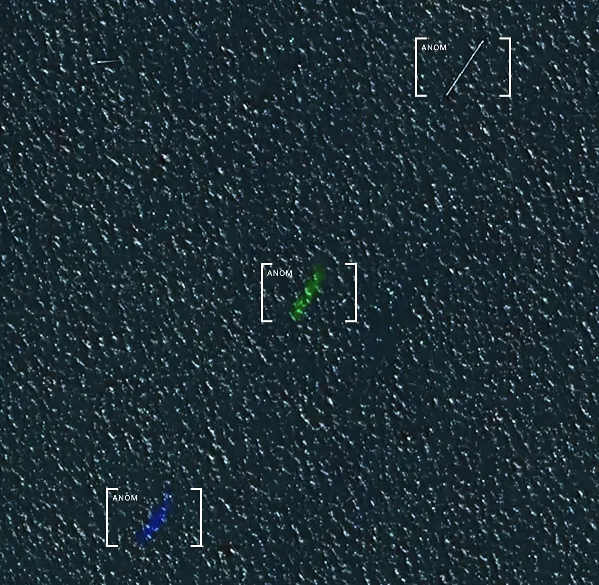 Three streaks in a line over water. One thin and white but solid, one semi-translucent green, and one semi-translucent blue.