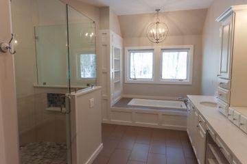 Remodeled master bathroom with custom cabinets, large walk in 2 person shower and soaking tub