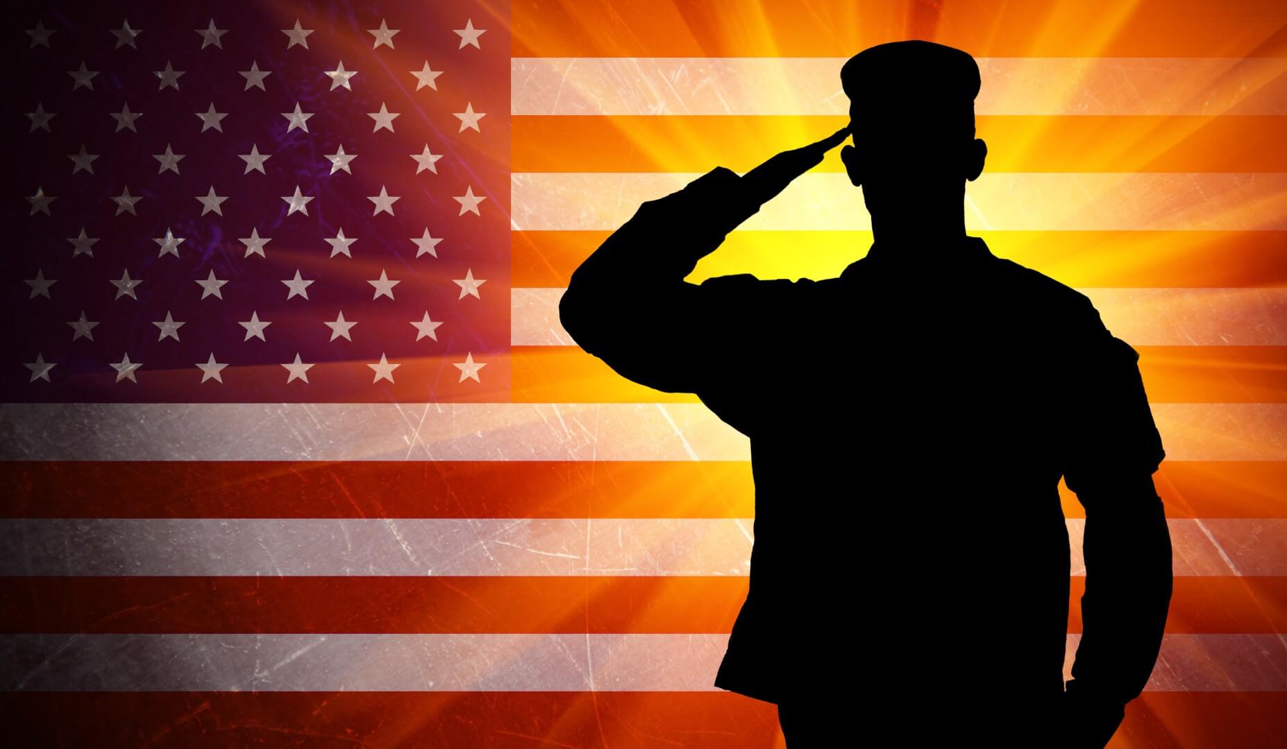 Veteran saluting the american flag, Veterans receive $500 off roof replacement, siding replacement , kitchen remodel, bathroom remodel, basement remodel.