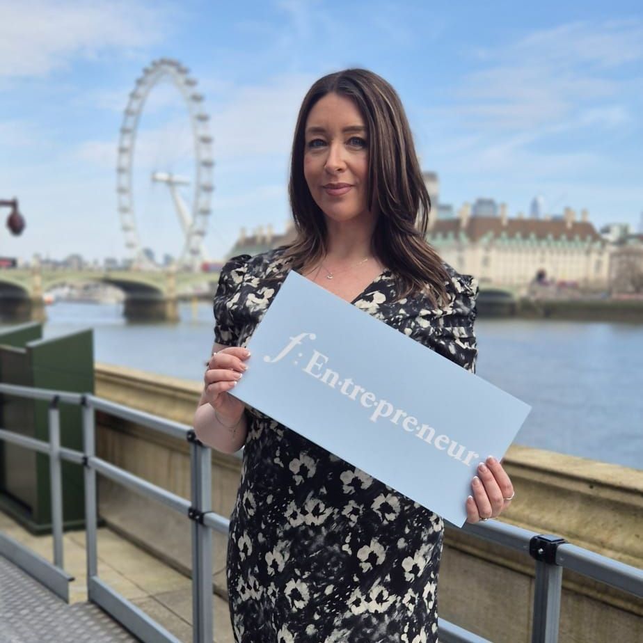 Deborah Monks on the House of Lords Terrace at Westminster holding an f:Entrepreneur sign