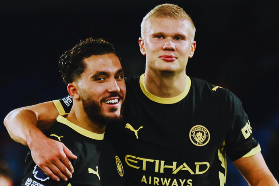 Rayan Cherki y Erling Haaland