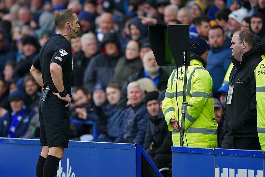 Premier League A referee watch a VAR screen in Premier League match