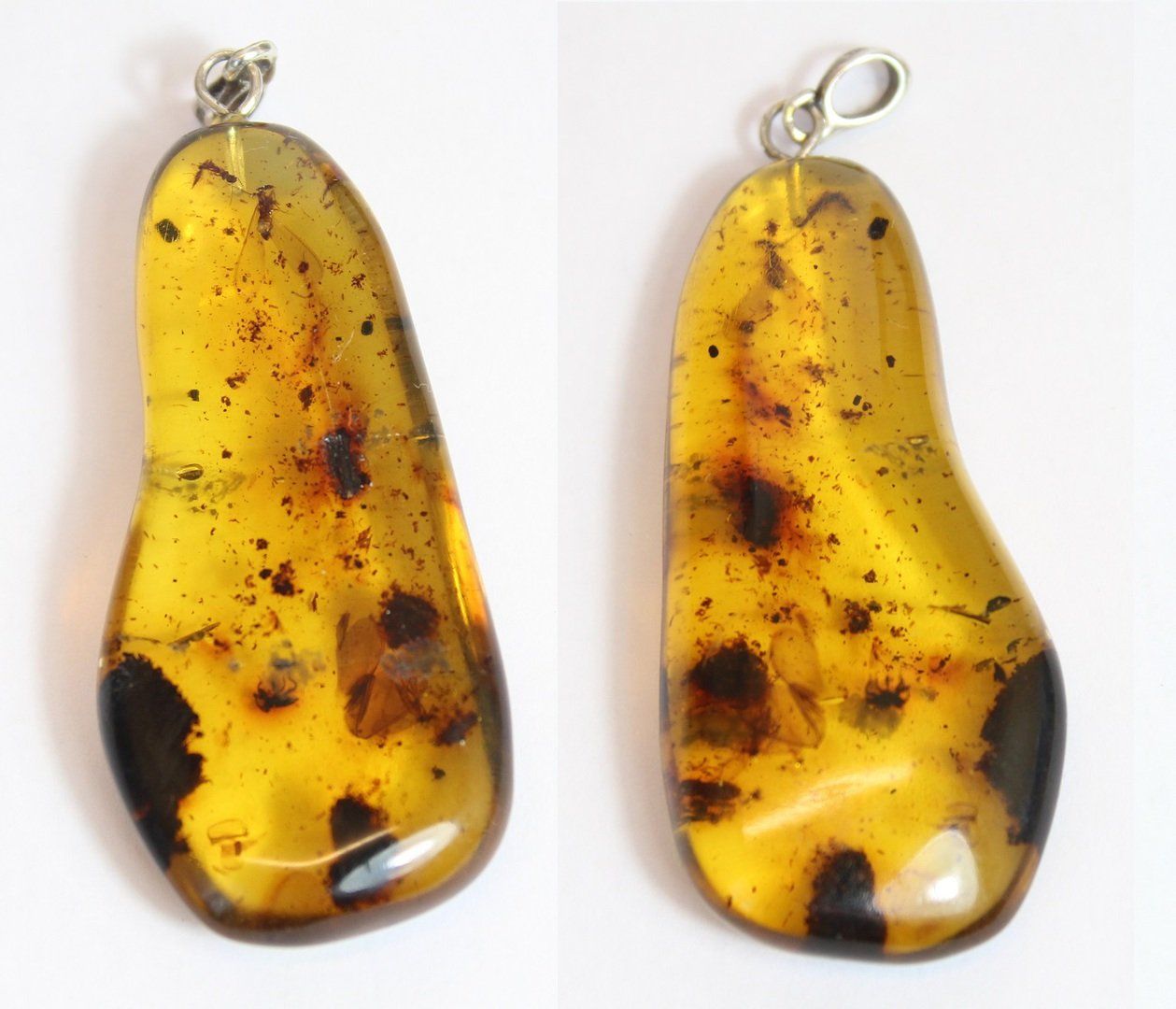 Restaurierung von Bernsteinanhänger. Atelier Reparatur Bernstein. Schließen von Rissen an Bernstein. Oberflächenüberarbeitung von Bernstein. Ergänzen von Fehlstellen mit speziellen Ergänzungsmassen Bernstein.