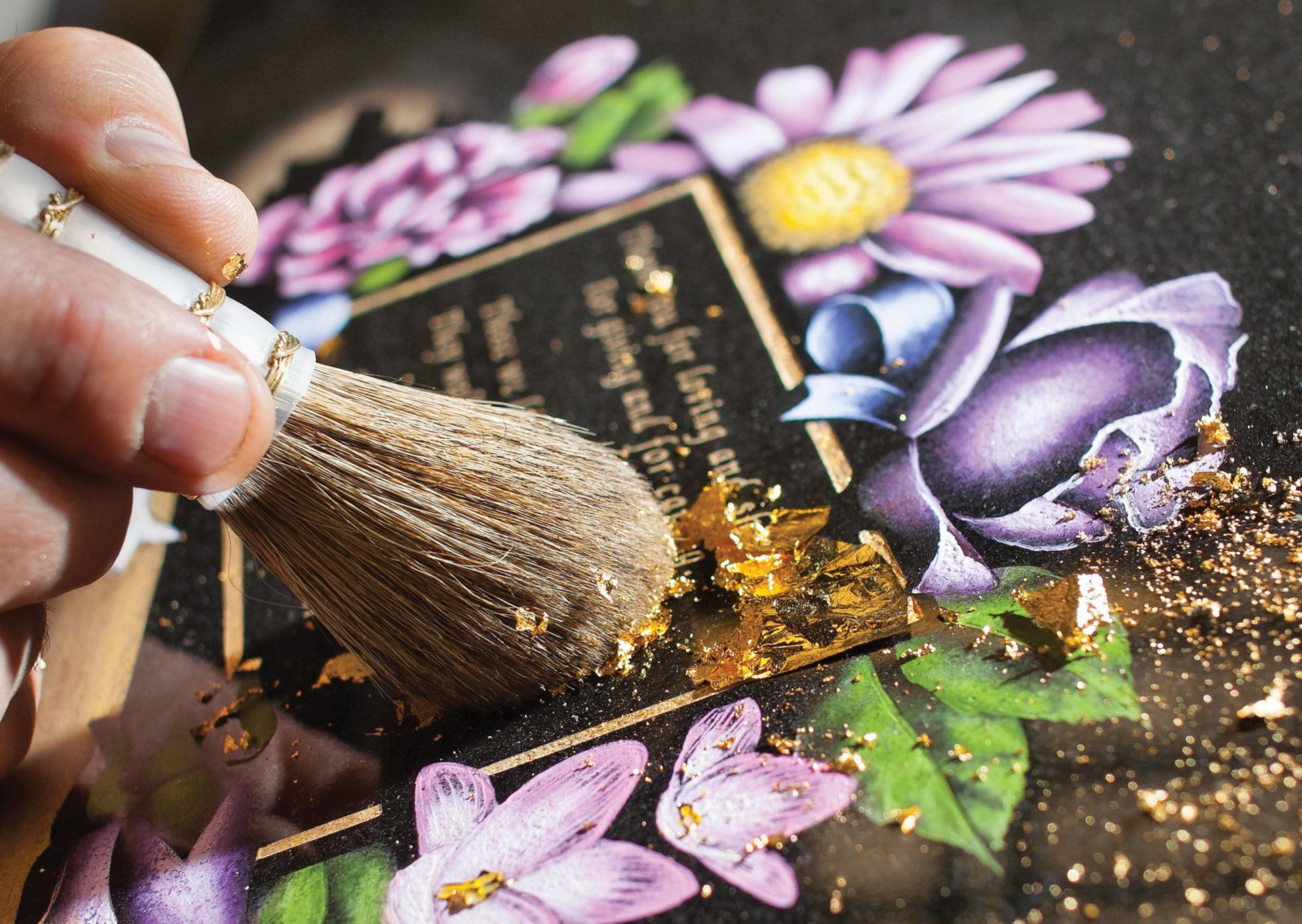 tombstones lined with plants and flowers