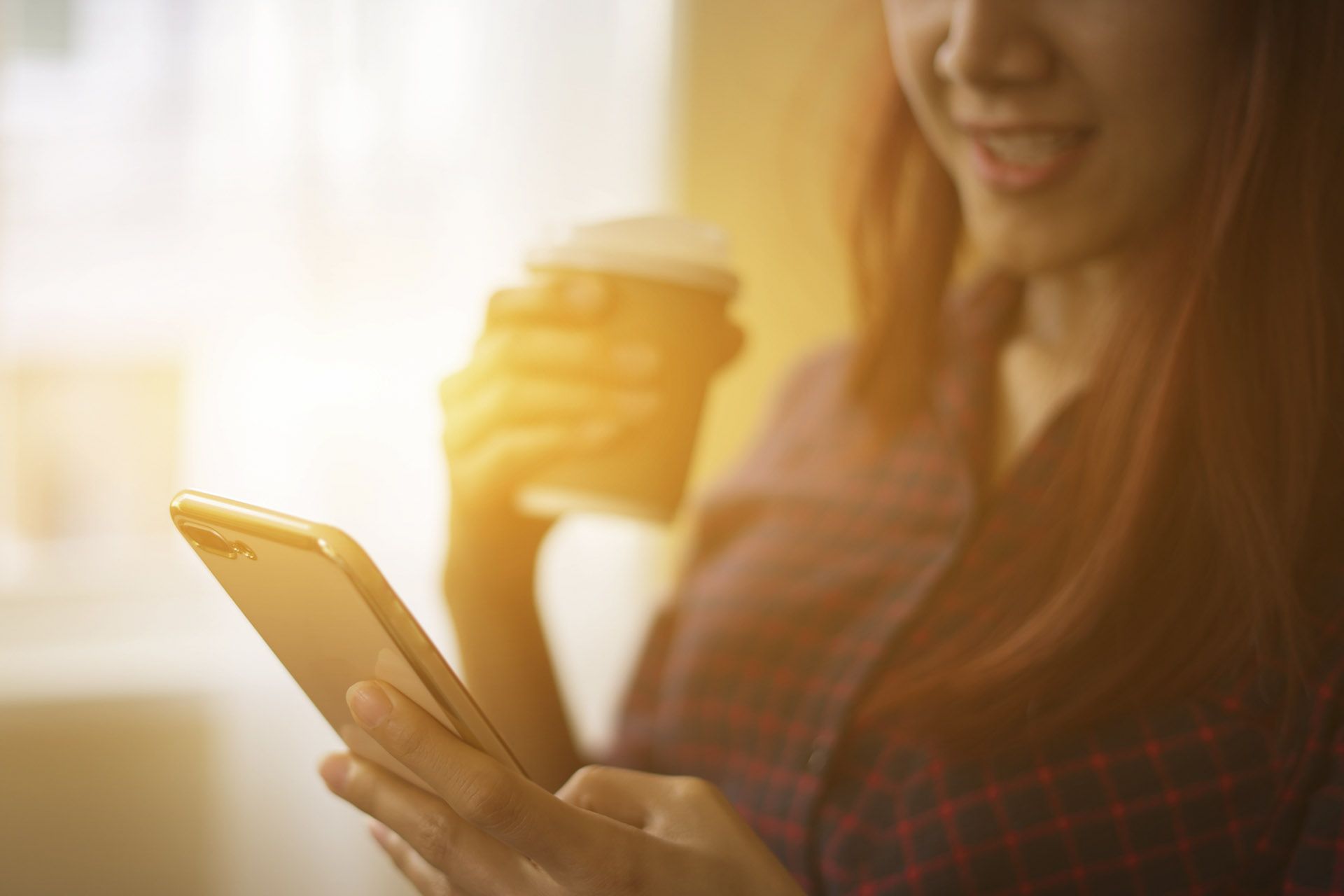 women making effortless money transfers via mobile in London