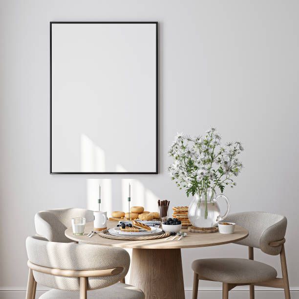 Minimalist white dining room featuring tones inspired by popular Home Office Paint Colors.