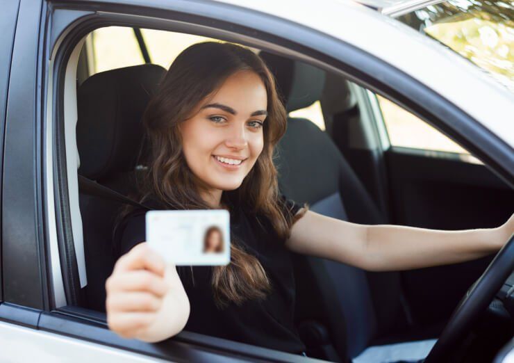 Learner driver celebrating passing her test