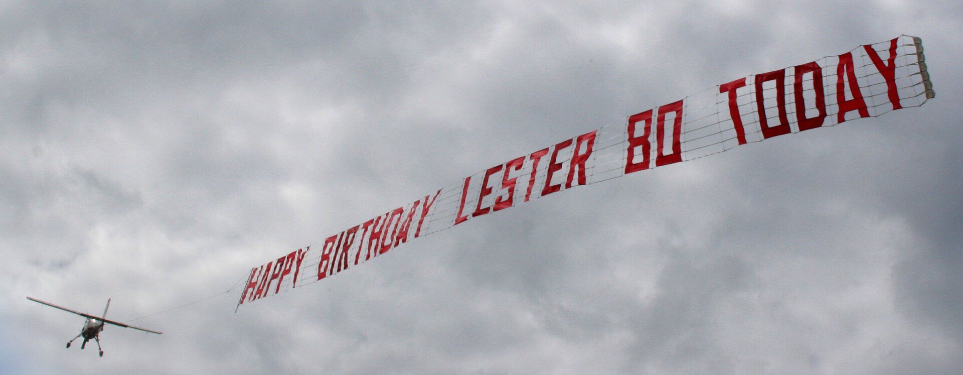 Personal Happy birthday message banner in the sky