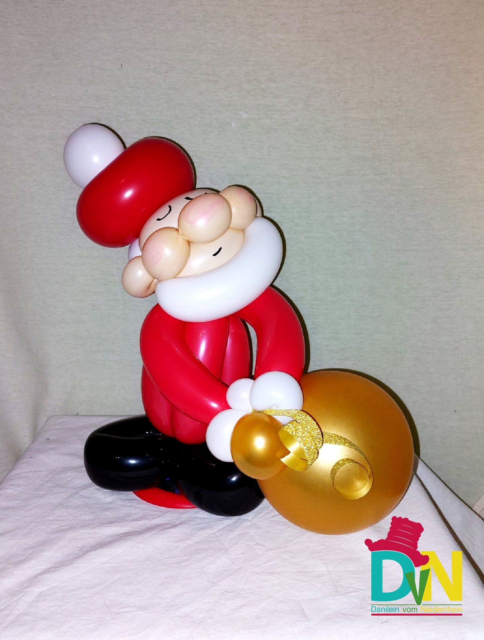 Kleiner Weihnachtsmann01/ca.0,25x0,20m/rot