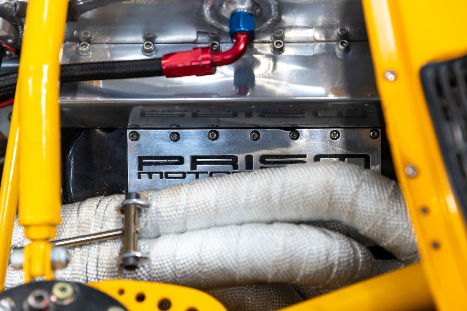 BMW E30 twin-turbo race car in burnt yellow