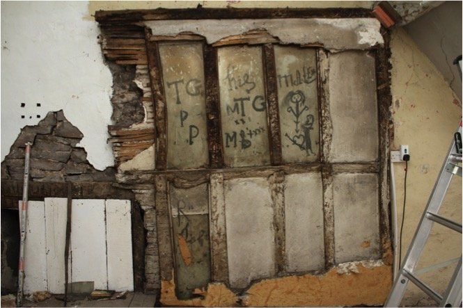 Graffiti on wall panels in the attic secret chapel