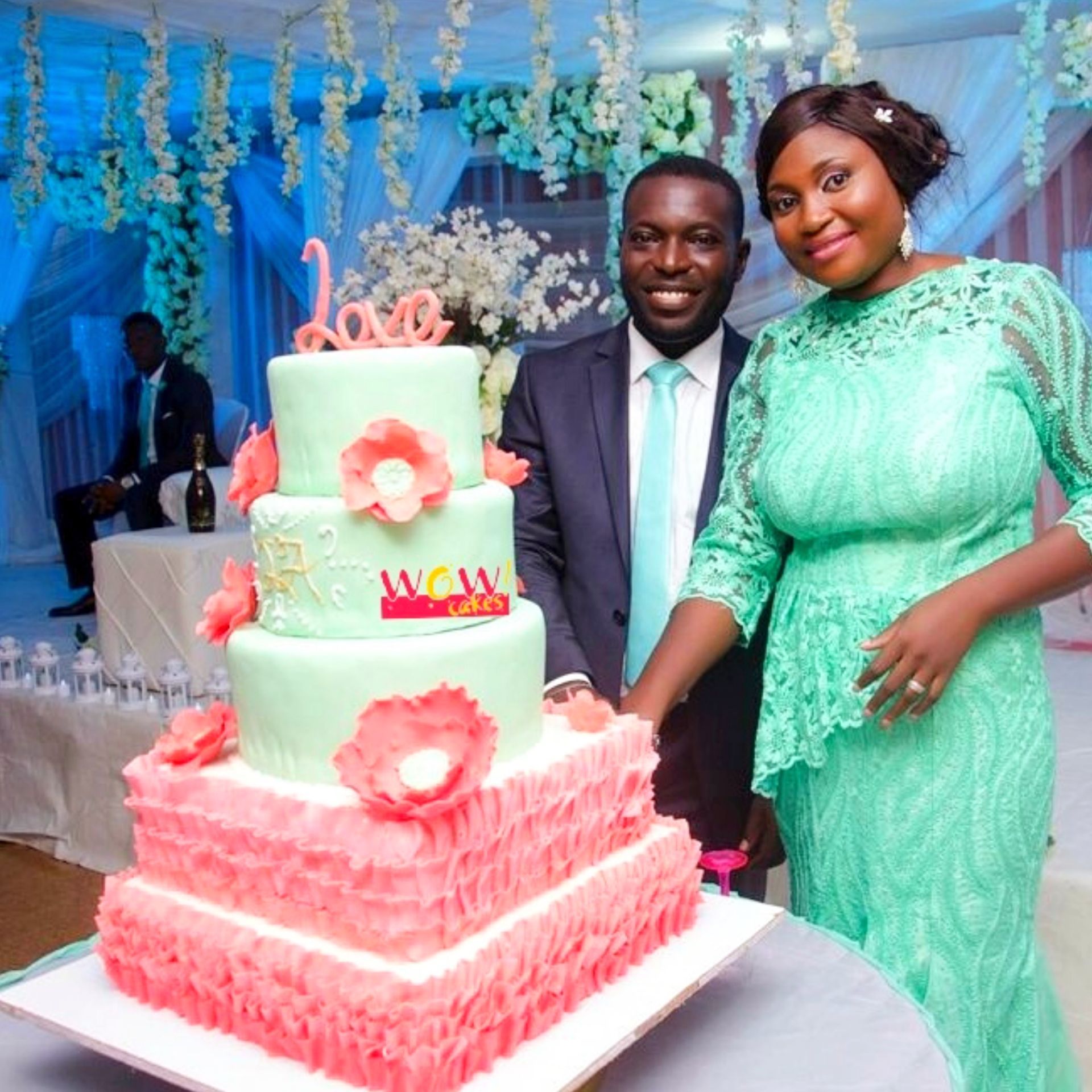 Couple cutting Their Wedding Cake held in Benin City