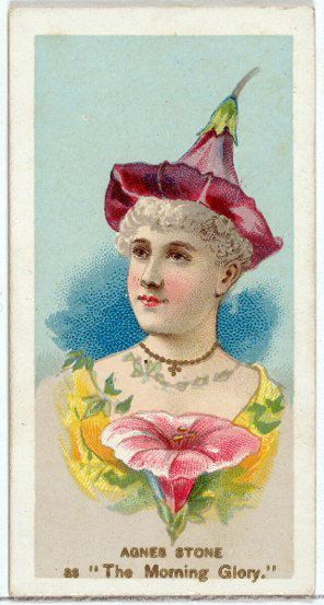 woman wearing a morning glory flower for a hat