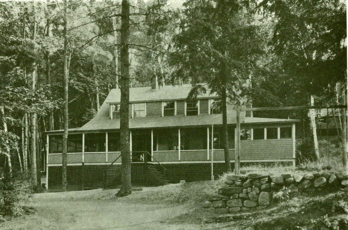 2 story Bugalow with large front porch that connects to a covered porch