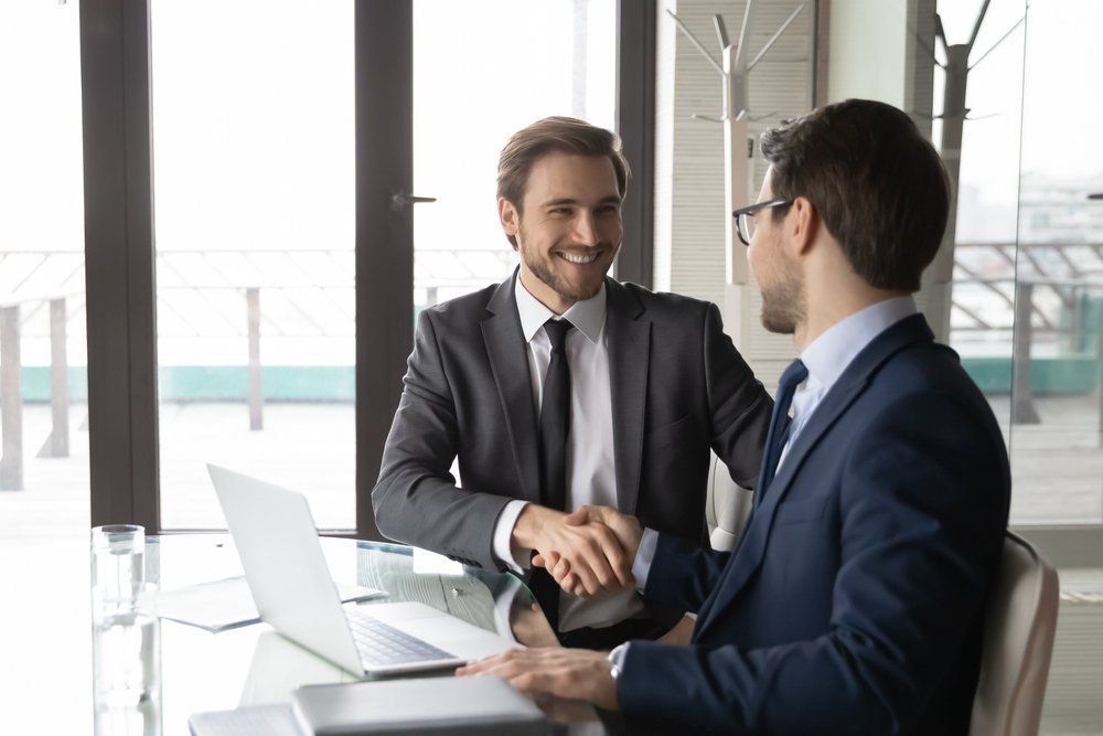 two men shaking hands