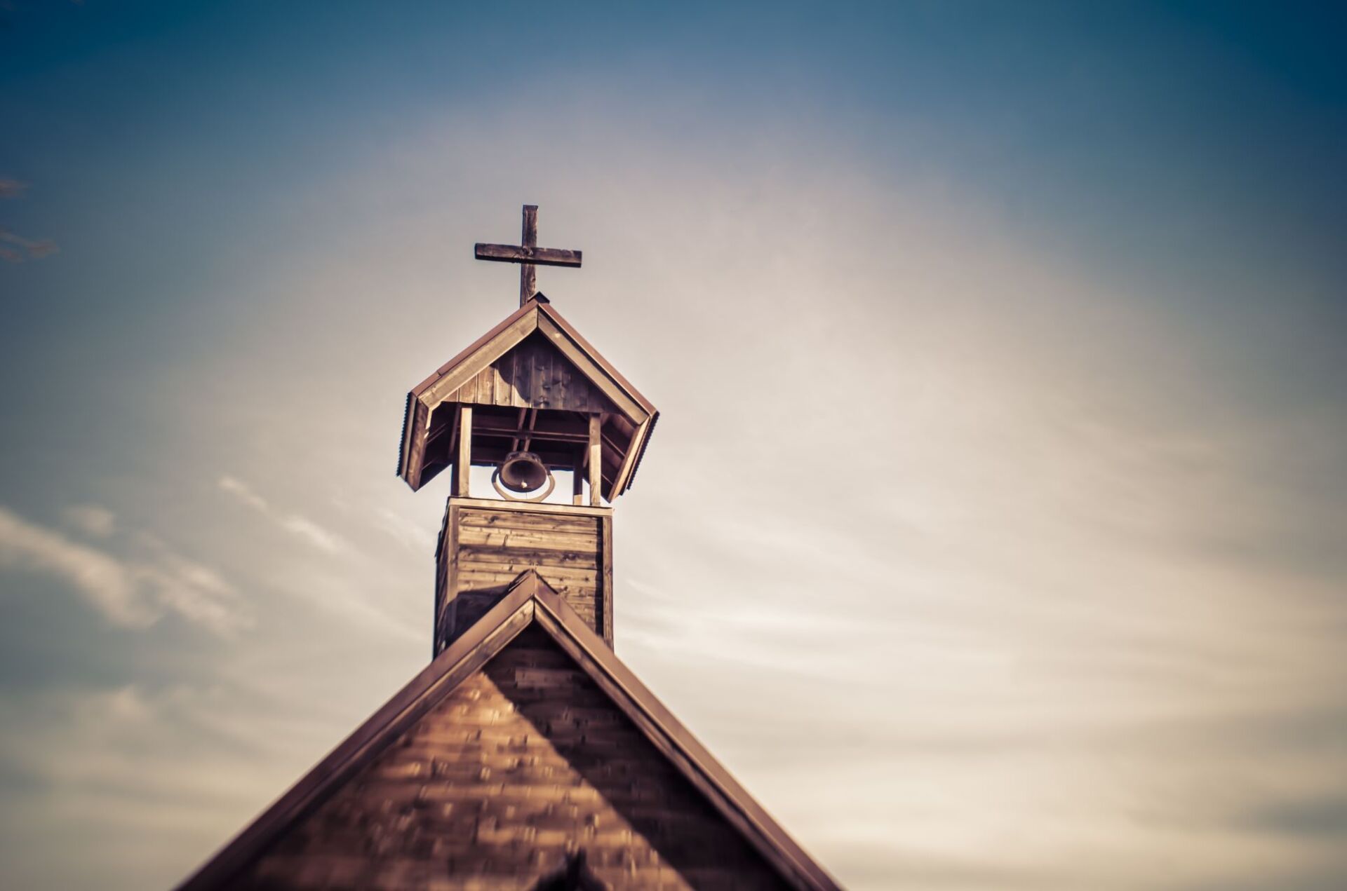 image of a church top with cross on top
