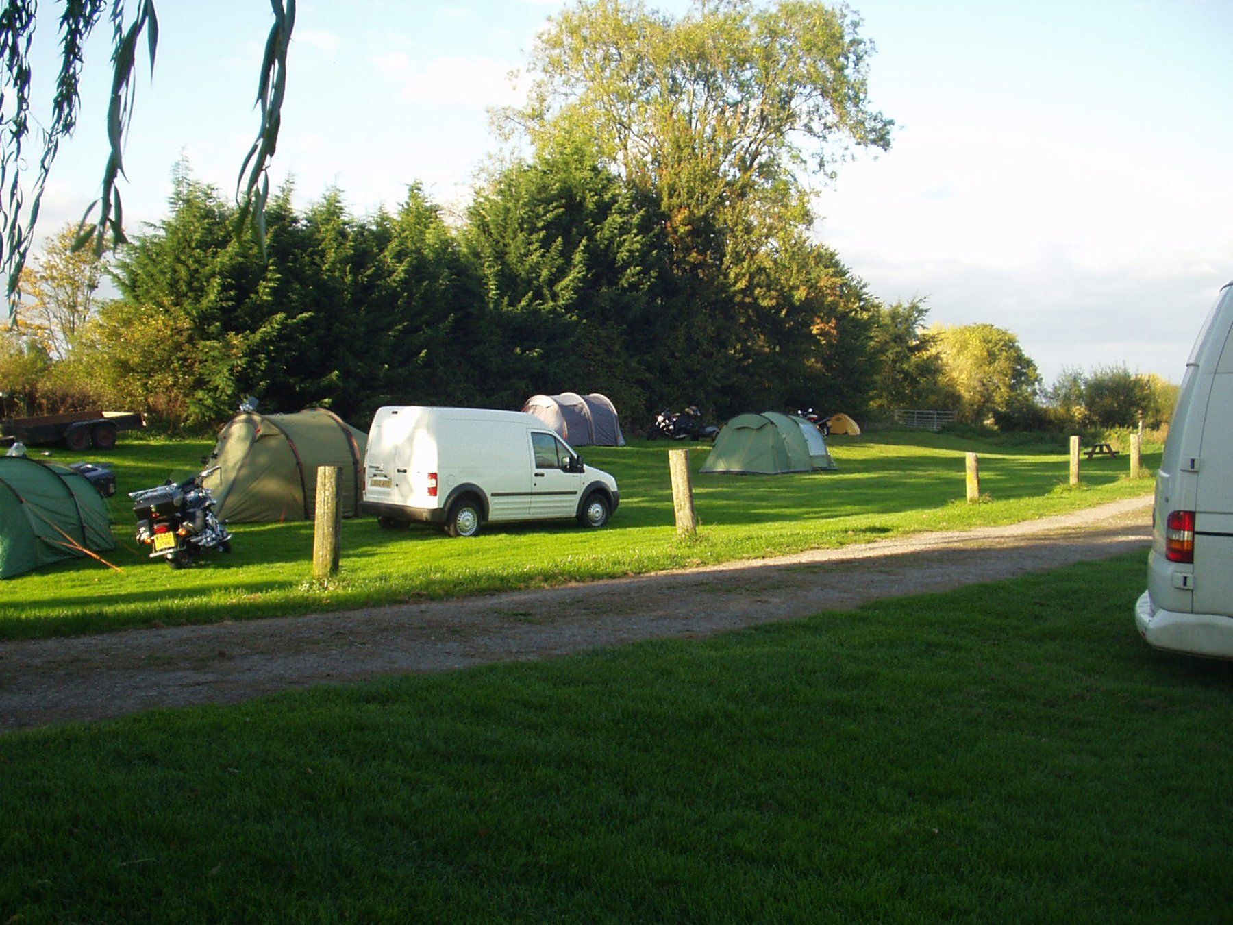 Lower Lode lawned riverside campsite for rustic camping in a tranquil setting near Tewkesbury, Gloucestershire
